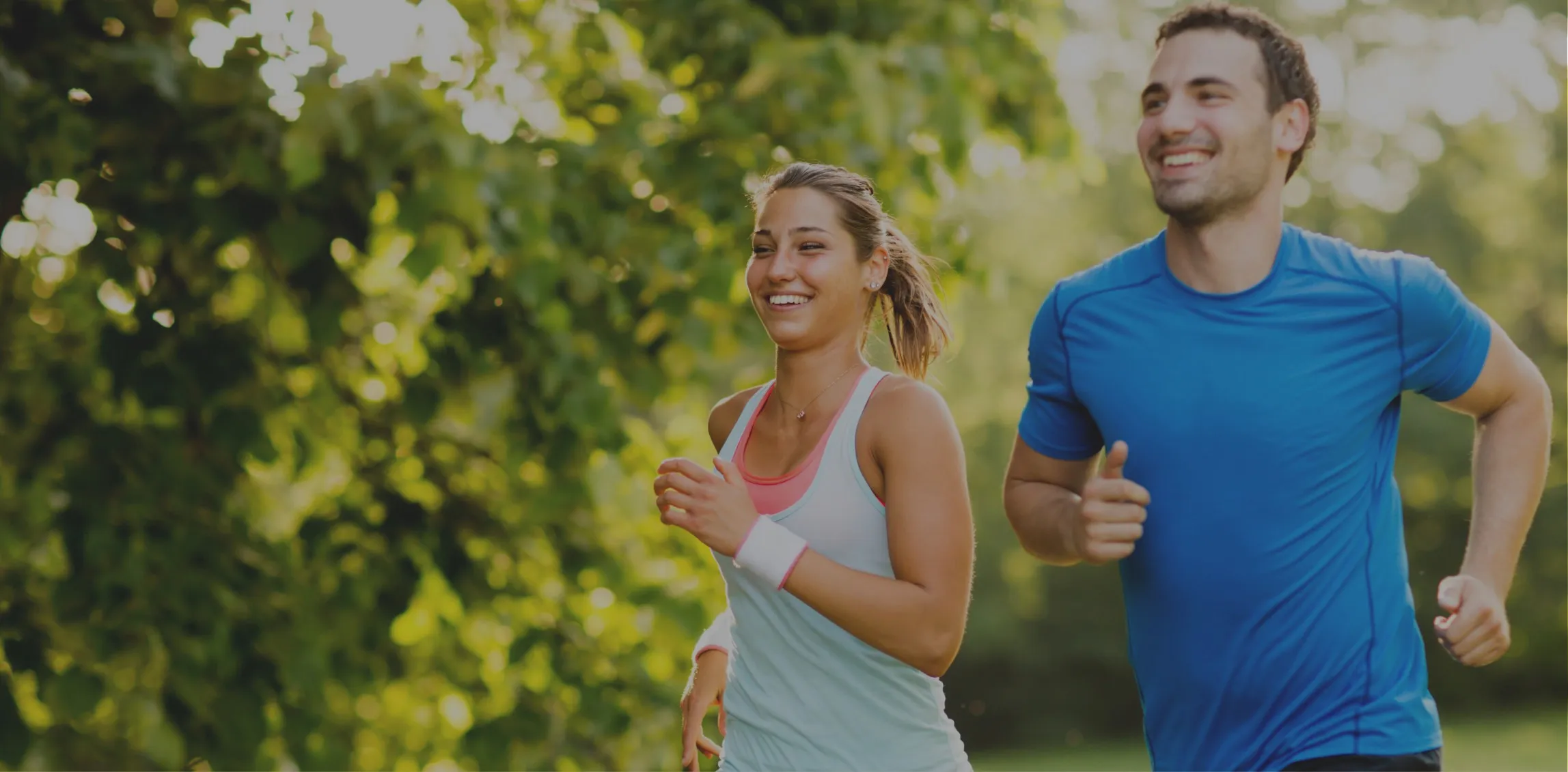 Healthy couple jogging and exercising at Civic Park Medical Centre